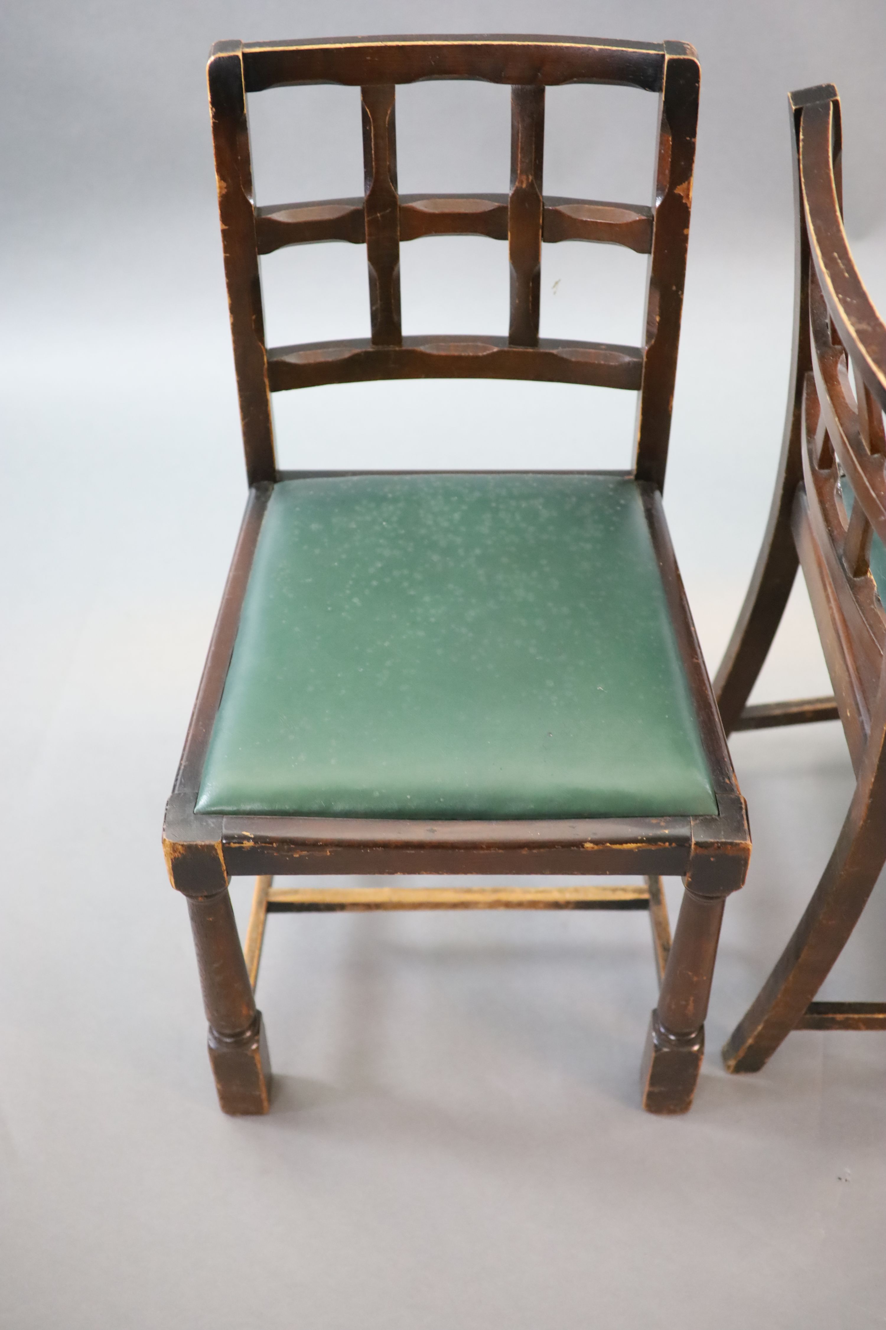 A set of ten early 20th century oak and beech dining chairs